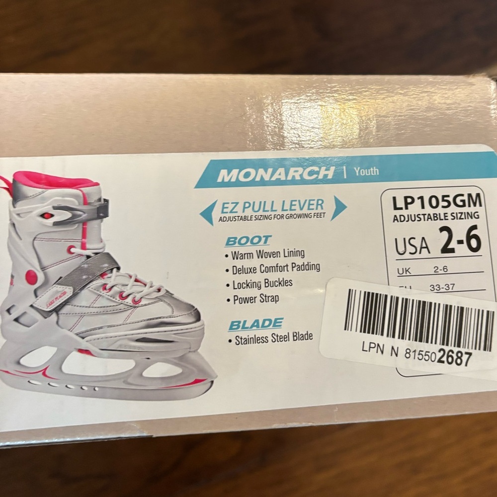 Adjustable silver and pink Ice Skates size Y2-6.